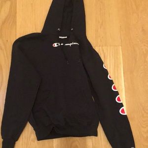 navy champion hoodie with logo on sleeve